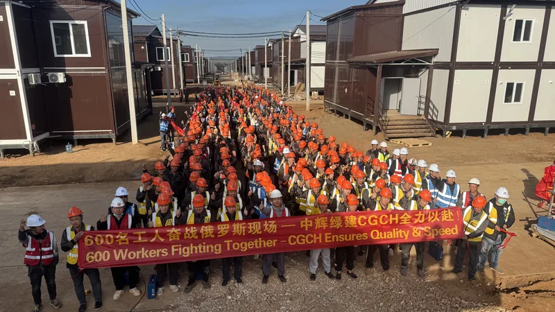 600 CGCH workers on-site in Russia between rows of brown two-story container compound — banner reads "600 Workers Fighting Together — CGCH Ensures Quality & Speed"