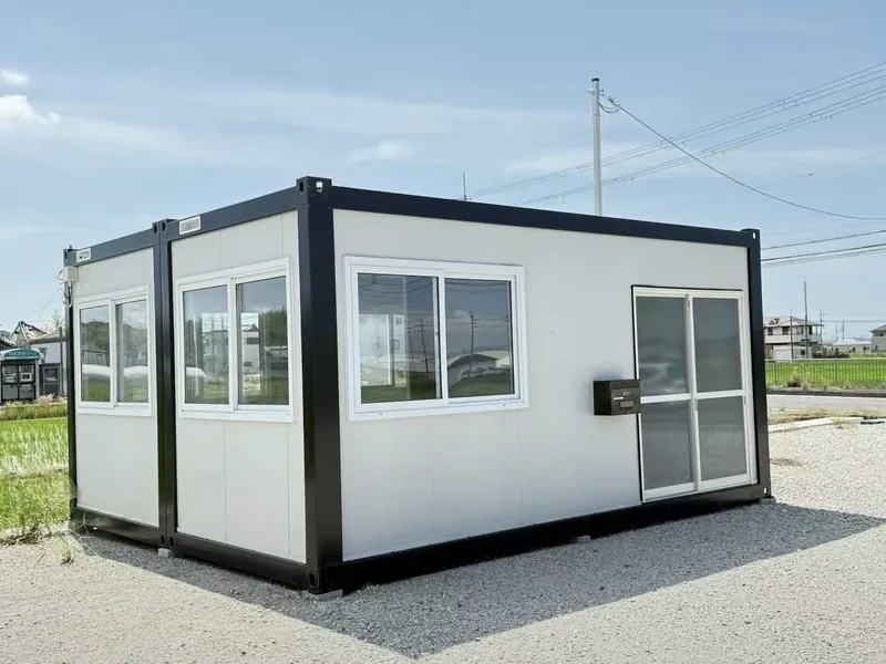 CGCH Flat-Pack House — white panels with sliding windows and door, 30-year lifespan, 4-floor stack capable